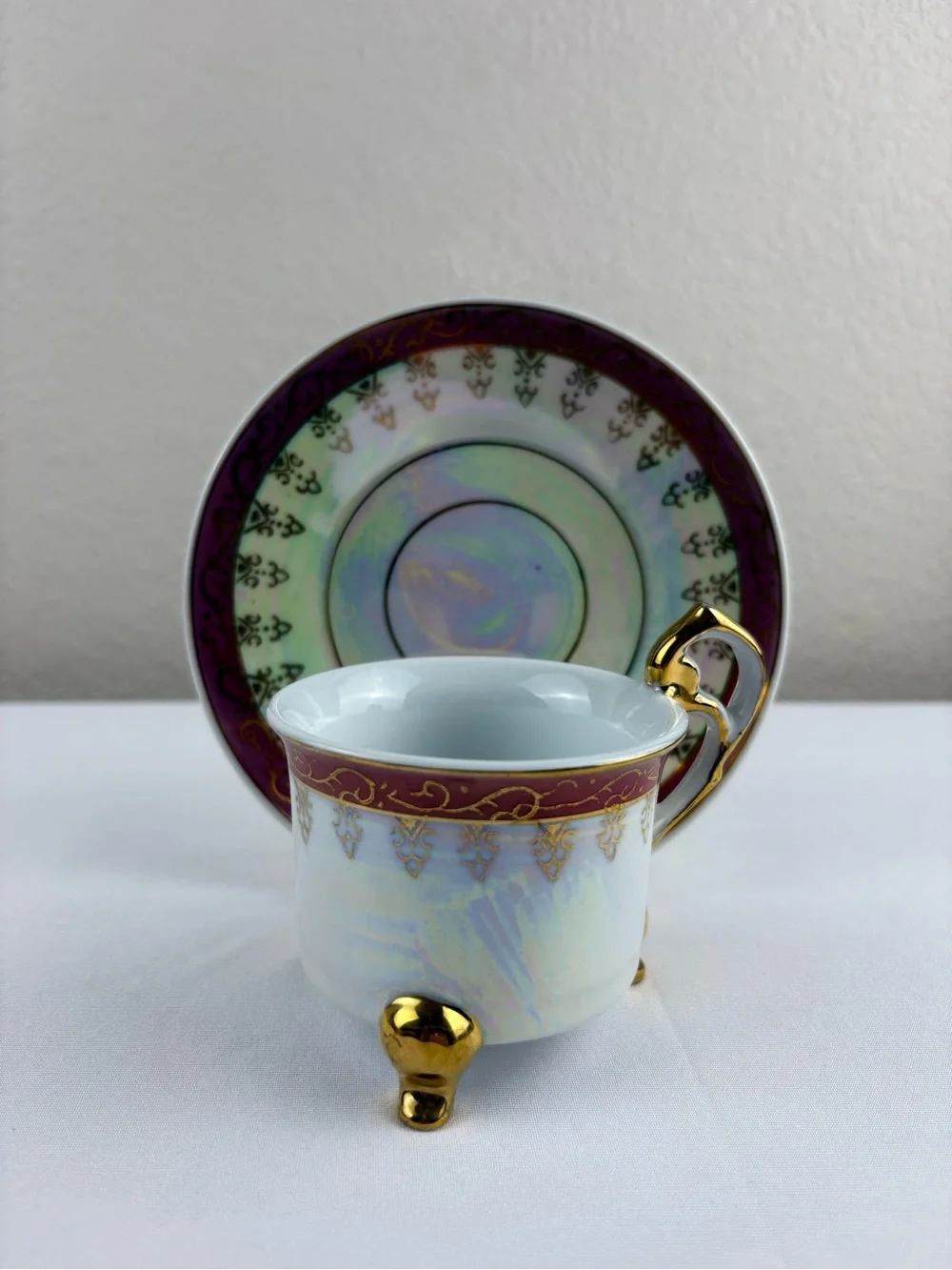 Vintage Porcelain Three-Legged Teacup and Saucer.
